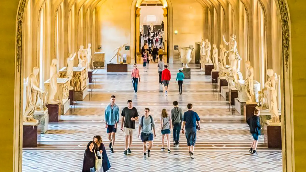 Louvre museum with a tour guide